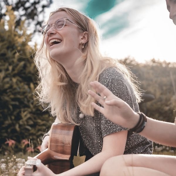 teen girl playing guitar